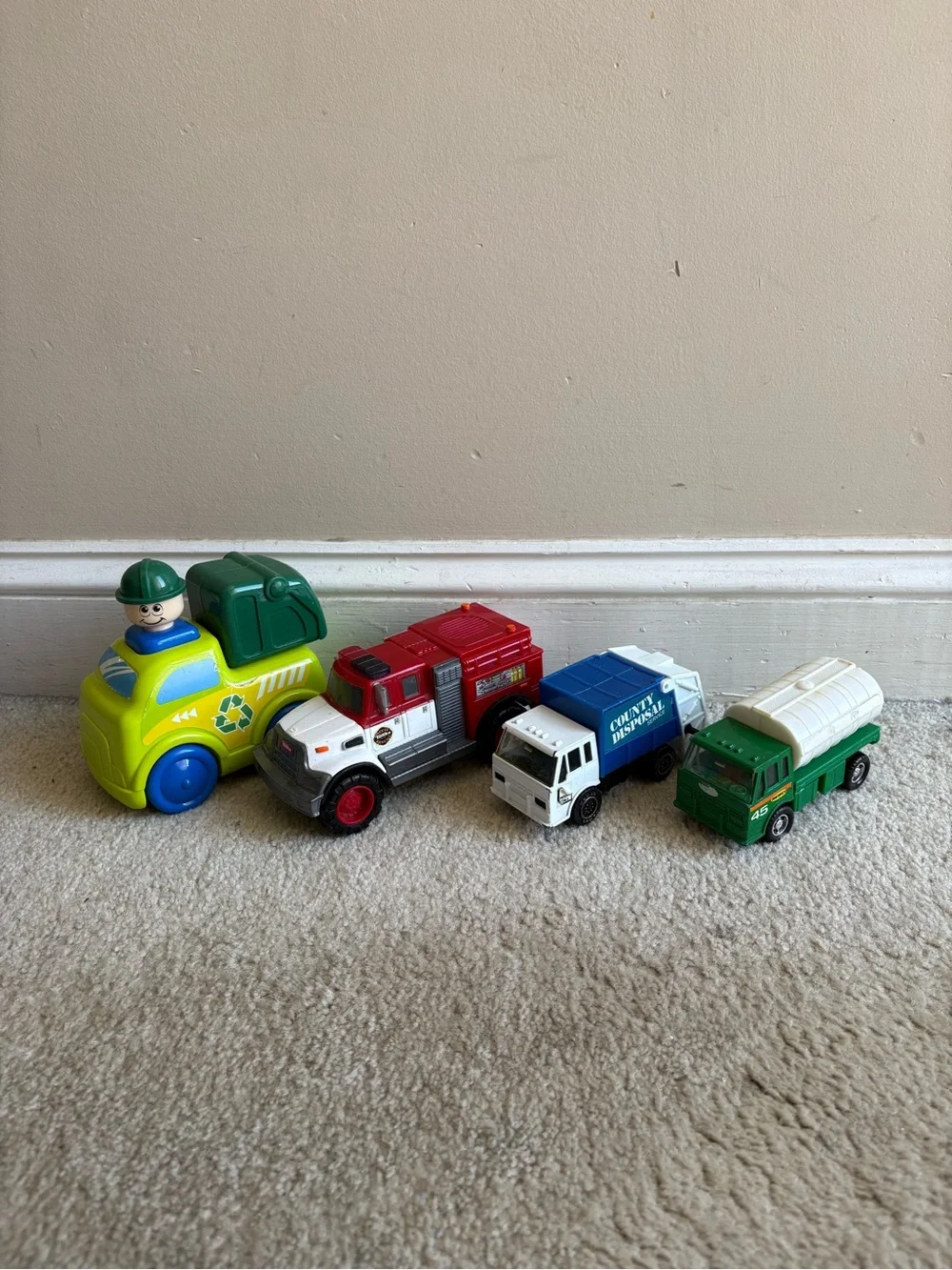 Lot of 4 play trucks for toddlers